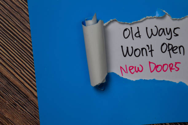istock Old Ways Won't Open New Doors Text written in torn paper. 1266708836