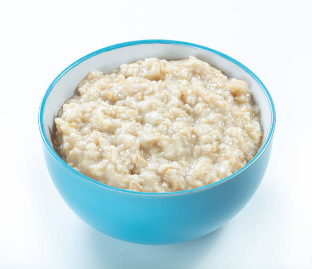 istock oatmeal  in blue ceramic bowl isolated white background 1266711314