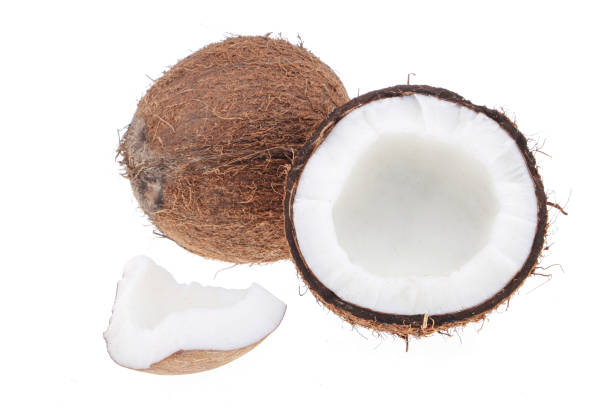 istock Fresh raw coconut with palm leaves isolated on white background. High resolution image 1266713778