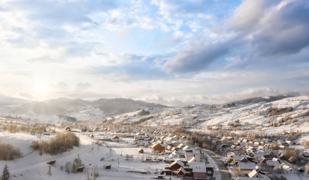 istock Beautiful village in mountain winter landscape 1266716480