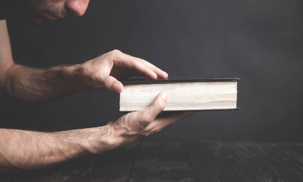 Caucasian man holding bible. Religion