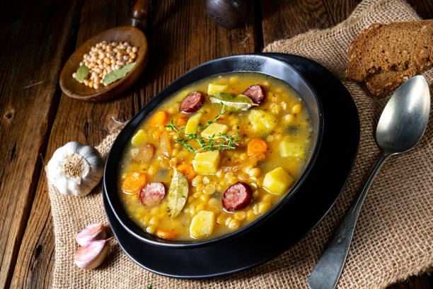 istock Rustic pea soup with bacon and sausages 1266719636