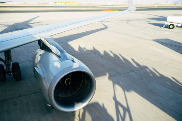 istock Passenger Aircraft boarding a plane on the runway 1266720520