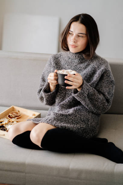 istock Woman enjoy hot chocolate and gingerbread 1266720582