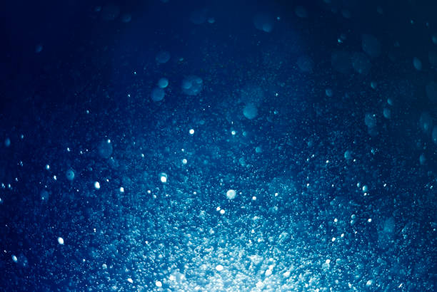 istock Abstract, blue bokeh defocus glitter blur on dark background. 1266725173