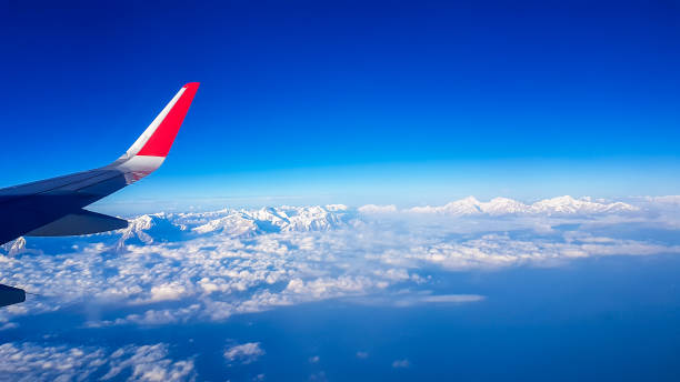 nepal - a plane view on snow capped himalayan peaks - mountain range earth sky airplane imagens e fotografias de stock