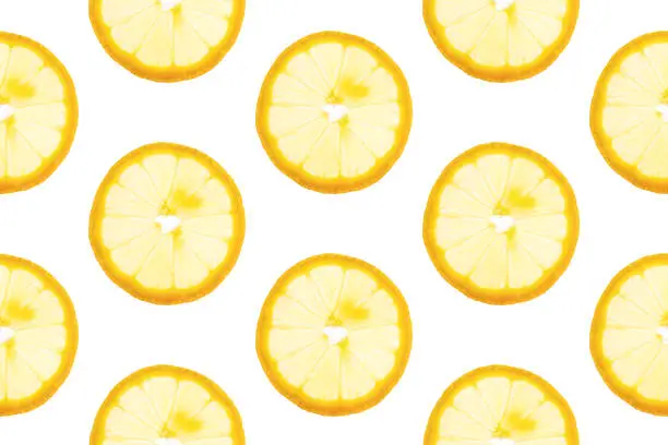 Seamless pattern from round transparent slices of ripe juicy yellow lemon on white background. Poster banner template backdrop for wallpaper product surface design