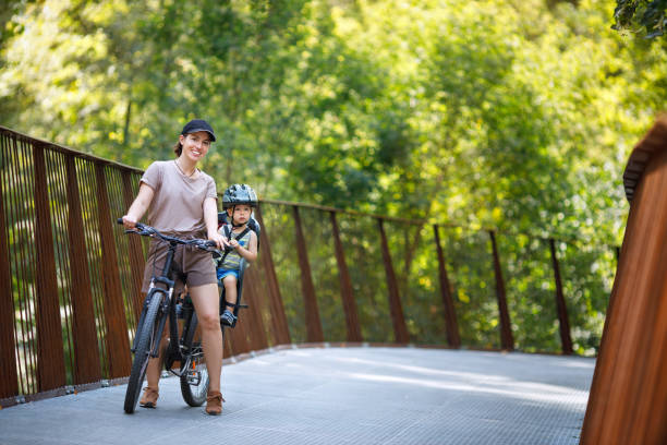 istock Mother with son riding on bike 1266729941