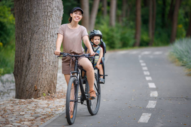 istock Mother with son riding on bike 1266729944