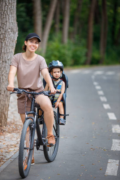 istock Mother with son riding on bike 1266729965