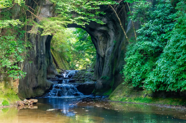 kameiwa cave in kimitsu city, chiba prefecture - spring waterfall japan landscape stock-fotos und bilder