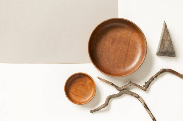 istock Empty wooden plates and tree branches on two neutral beige colors paper backgrounds, top view. Rustic cafe or restaurant menu concept. Flat lay composition 1266734689