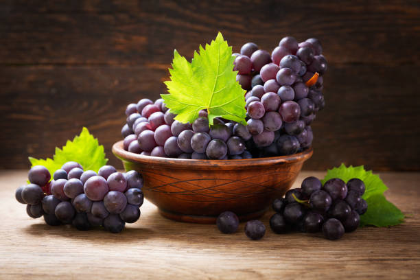 istock fresh ripe grapes with leaves in a bowl 1266735679
