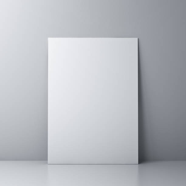 istock Blank white board or white sheet of paper template isolated against the wall with shadow and reflection 1266735721