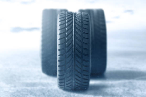 istock Car tires in winter background 1266735935