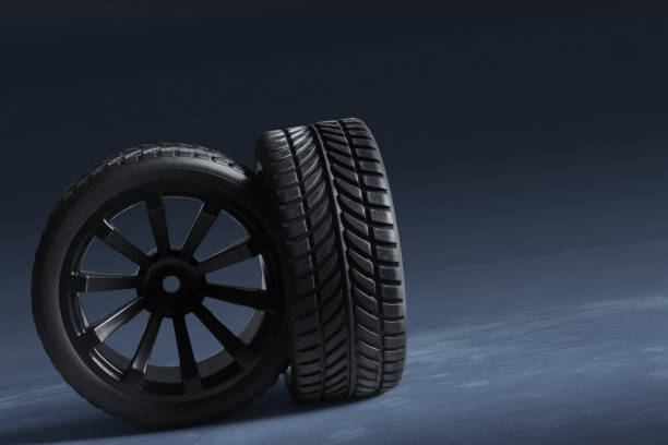 istock Car tires on dark background 1266737137
