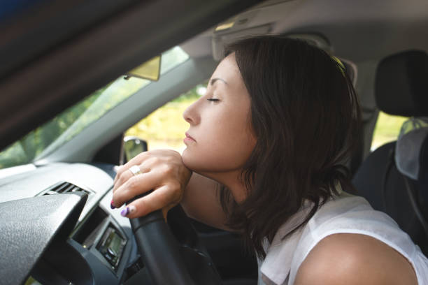 istock Stressed woman driver sitting inside her car. driving safety concept 1266739571