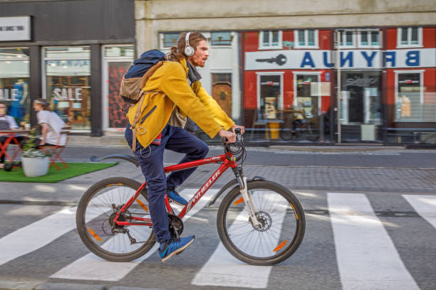 Reykjavik, Iceland, July 4, 2020: Young man on a bike in the main street of Reykjavik, the capital of Iceland