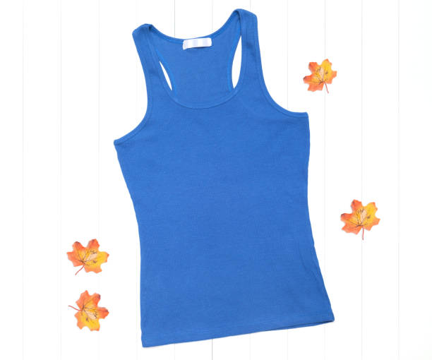 istock Blue tank top and bright autumn leaves on a white background 1266739585