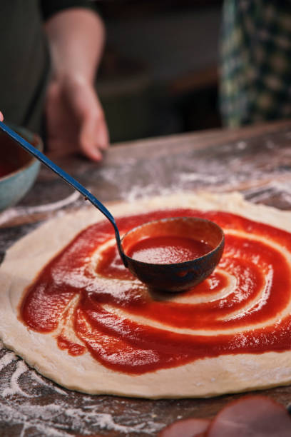 istock Kids Baking Pizza at Home in Domestic Kitchen 1266742102