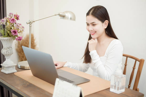 istock Beautiful woman is working from home 1266742482