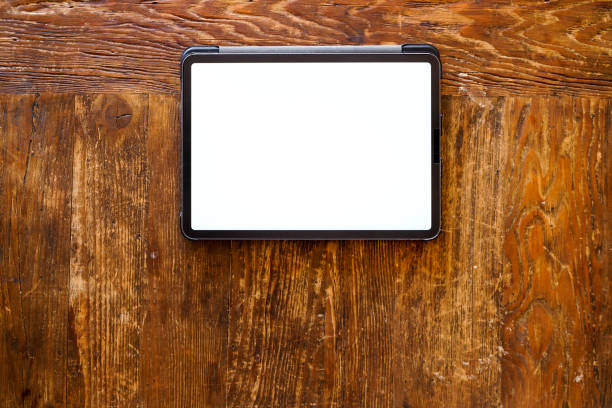 istock pro tablet with pencil flat lay on wooden table 1266743763