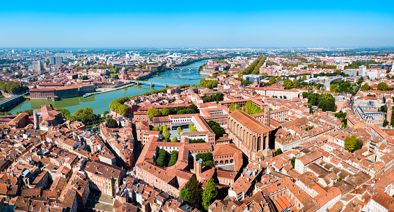 Toulouse and Garonne river aerial panoramic view. Toulouse is the capital of Haute Garonne department and Occitanie region in France.
