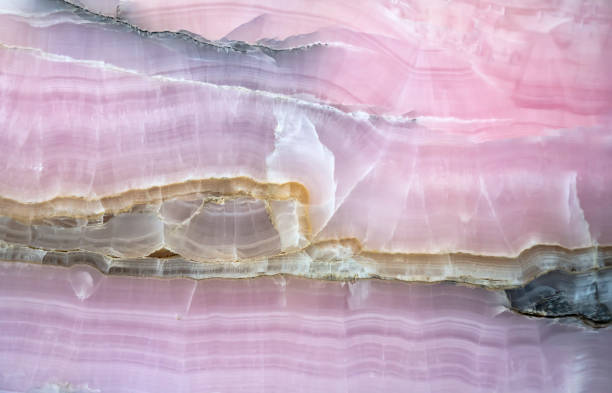 Mineral stone with abstract stripes has been formed of volcanic rock that has been molten and precipitated over thousands of years in the natural world. They are decorated indoors as floor tiles, wall