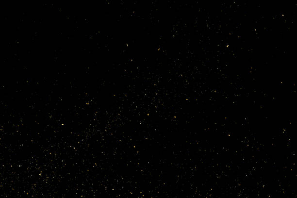 Golden stardust vector Gold Glitter Texture Isolated on Black Background. Golden stardust. Amber Particles Color. Sparkles Rain. Vector Illustration, Eps 10. dust stock illustrations