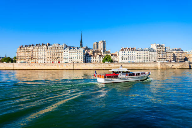 Tourist city tour boat on the Seine river in Paris in France