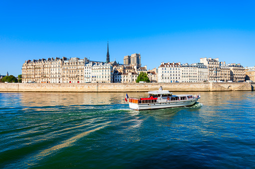 Paris, France: A river cruise on the Seine River run by Bateaux Parisiens; the bridge in the background is the Pont Neuf.