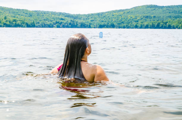 istock Woman getting out of water 1266751624