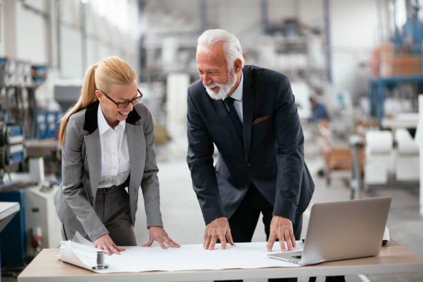 istock Man and woman discussing work. 1266751828