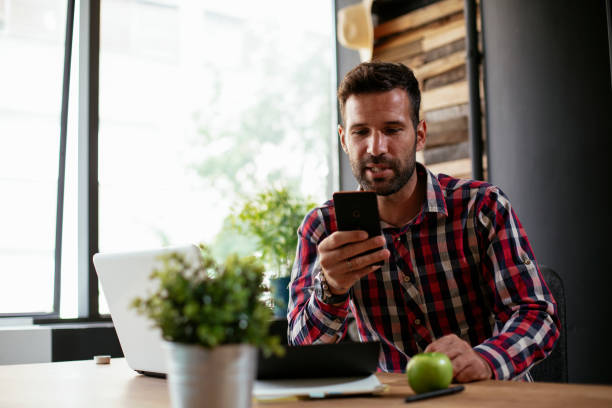 istock Handsome man talking to the phone. 1266752066