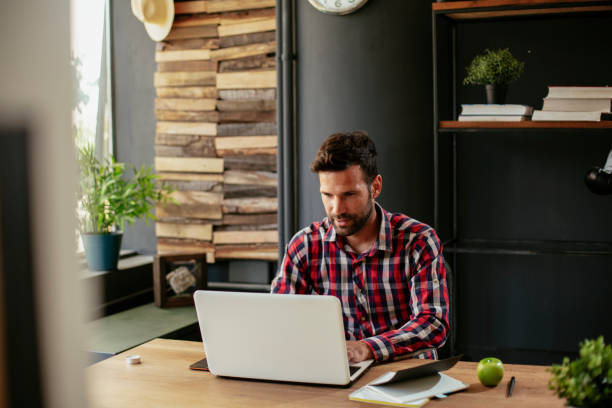 istock Young businessman working on laptop. 1266752798