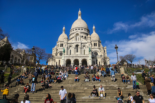 The Basilica of the Sacred Heart of Paris, commonly known as Sacré-Cœur Basilica and often simply Sacré-Cœur (French: Basilique du Sacré-Cœur), is a Roman Catholic church and minor basilica, dedicated to the Sacred Heart of Jesus. A popular landmark and the second most visited monument in Paris, the basilica stands at the summit of the Montmartre, the highest point in the city.