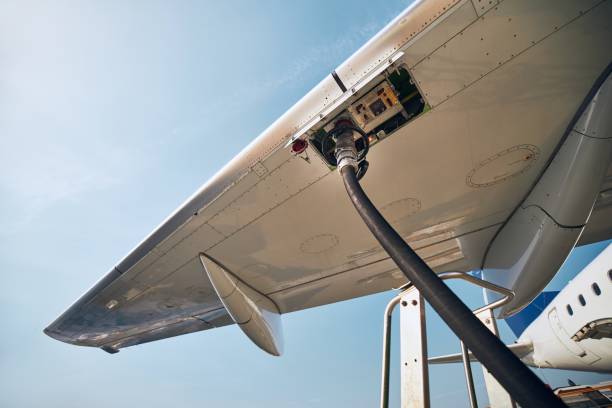 Refueling of airplane Ground service before flight. Refueling of airplane at airport. fossil fuel stock pictures, royalty-free photos & images