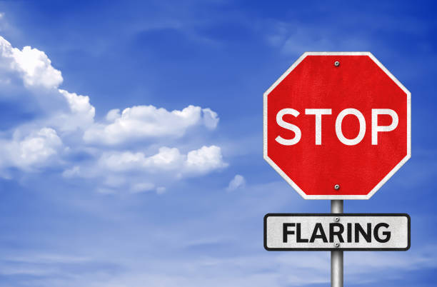 istock Stop Flaring of Gas - roadsign message 1266755595