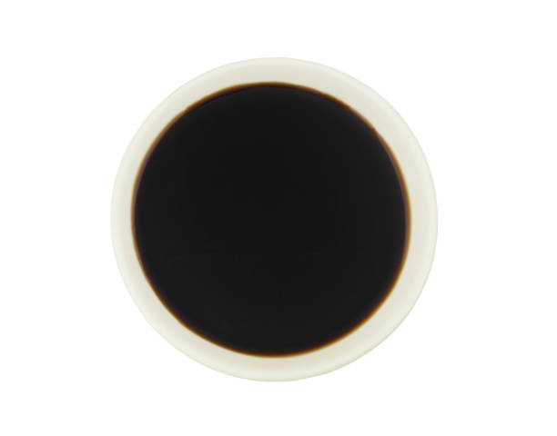 istock Soy sauce in white bowl isolated, top view 1266758663