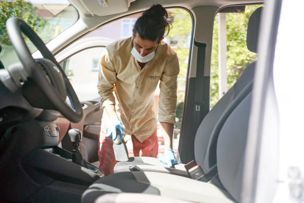 istock A man cleaning car with microfiber cloth. Car detailing or valeting concept. Selective focus. Car detailing. Cleaning with sponge. Worker cleaning. Car wash concept solution to clean 1266761079