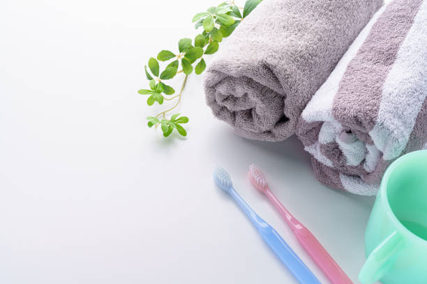 The toothbrushes, cup and towel The toothbrushes, cup and towel bad breath couple stock pictures, royalty-free photos & images