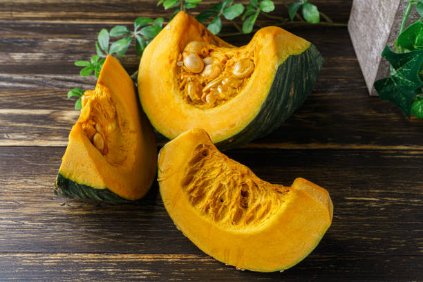 Fresh Japanese pumpkin with pumpkin seeds Fresh Japanese pumpkin with pumpkin seeds squash vegetable stock pictures, royalty-free photos & images