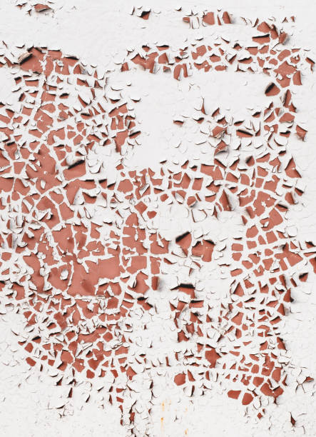 istock Abstract background with white paint peeling off on the old brown wall. 1266765184
