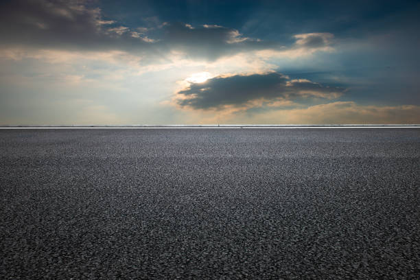 istock Evening glow, flat and wide asphalt road 1266767648