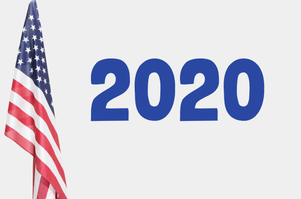 istock American flag with 2020 written in Blue 1266768035