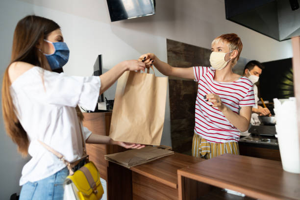 istock Picking up food from a restaurant during coronavirus pandemic 1266768907