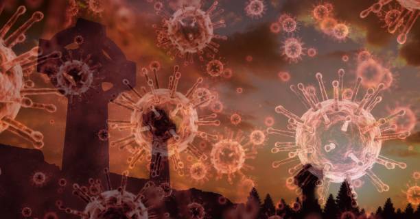 istock Covid-19 cells against cross 1266769092