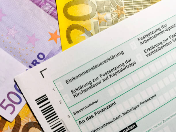 istock Euro banknotes and tax return 1266770690