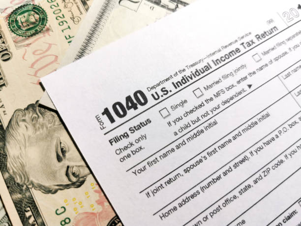 istock Dollar banknotes and tax returns in the USA 1266770761