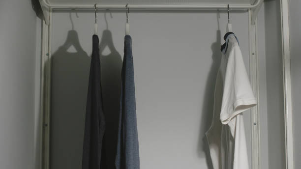 istock Several Male's clothes in a wardrobe at home 1266772426